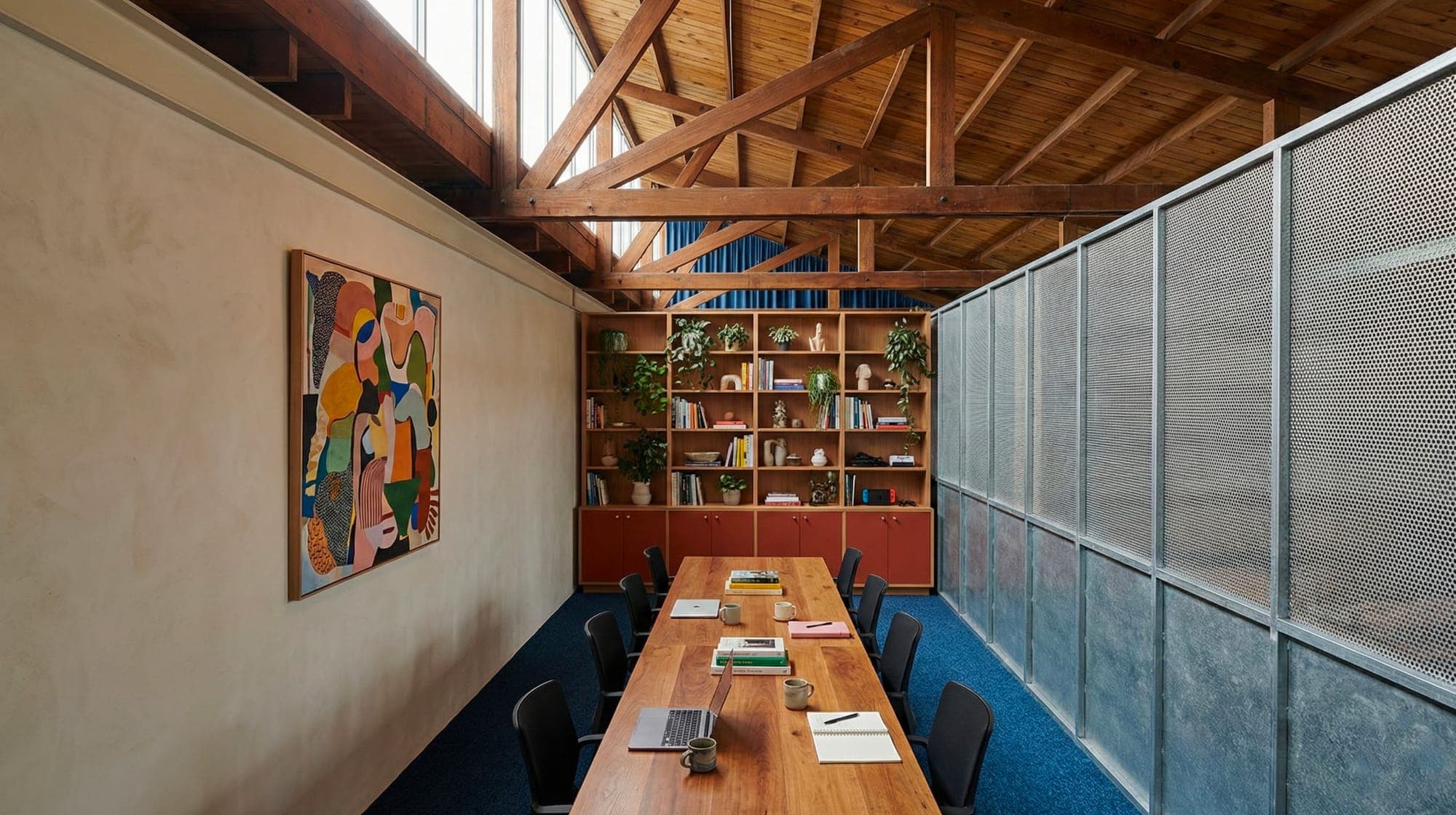 The MASS warehouse floor, desks under the timber trusses